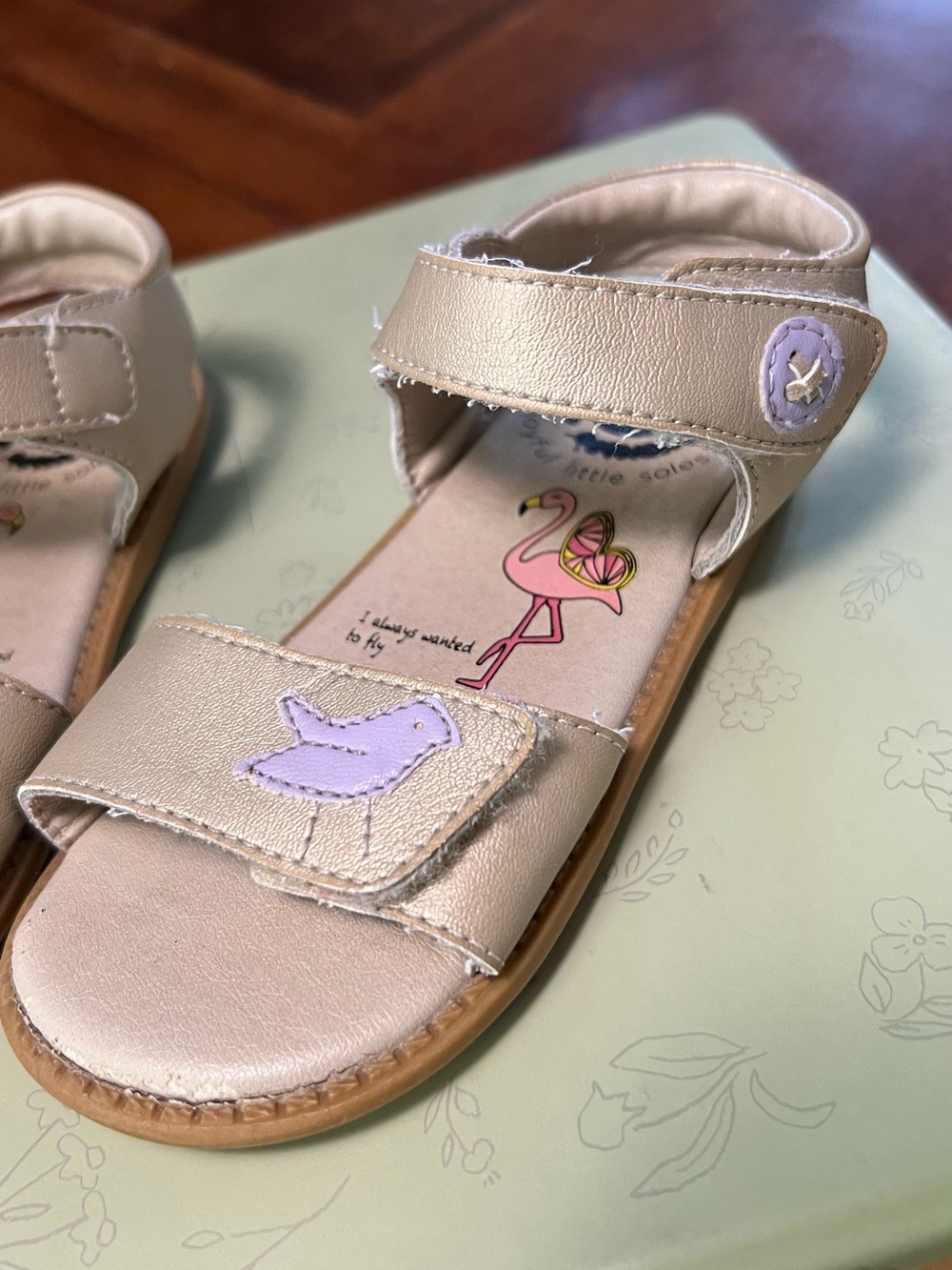 Livie & Luca Metallic Cream Sandals with Lilac Bird Detail